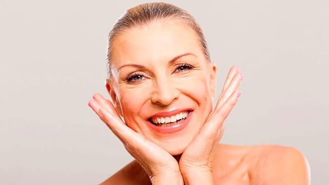 Happy woman in her 50s after facial skin care