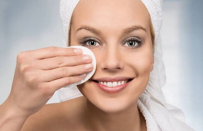 The girl wipes her face